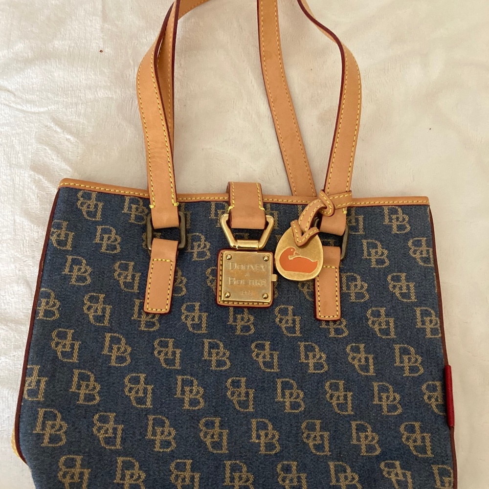 Dooney & Bourke Pocket Book Excellent Condition Bought and never used.